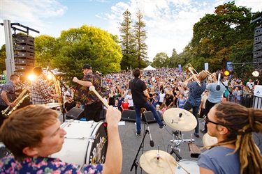 Sunset sound band playing to crowd
