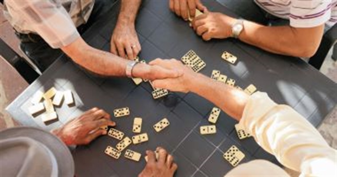 senior_hands_playing_dominoes