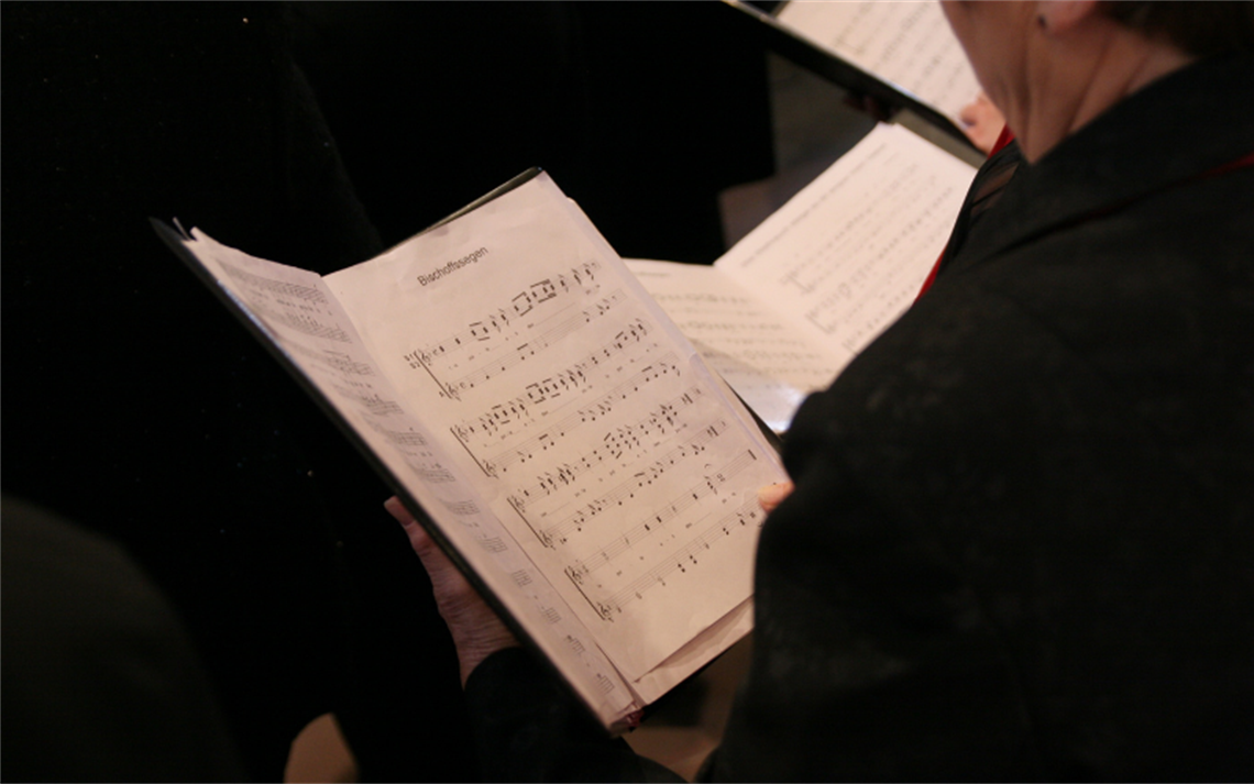 Singer looking at sheet music
