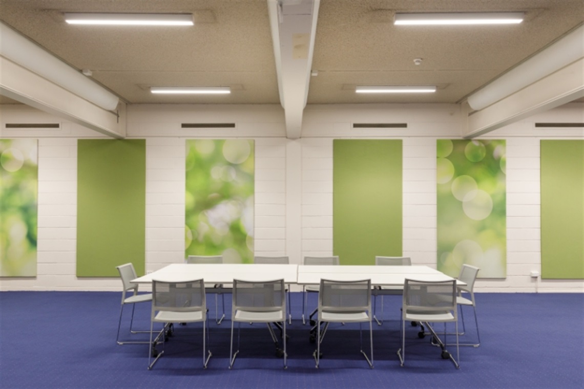 Tables and chairs set up for meeting