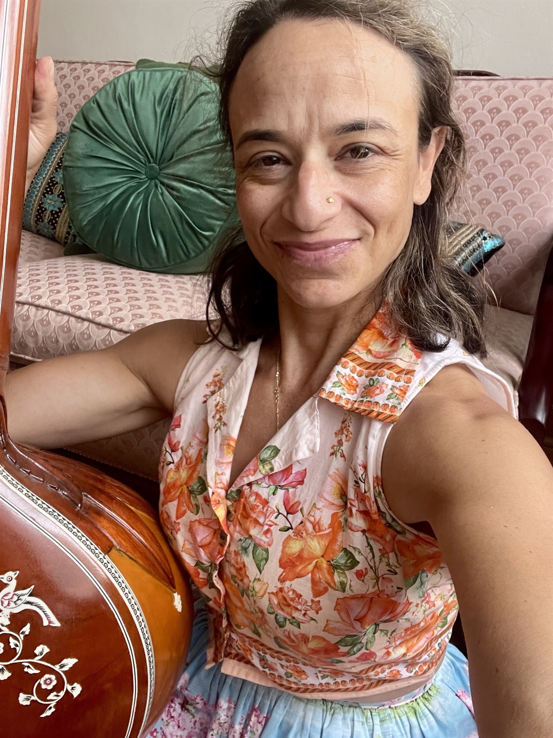 Nicole playing the Tanpura, an ancient Indian musical instrument